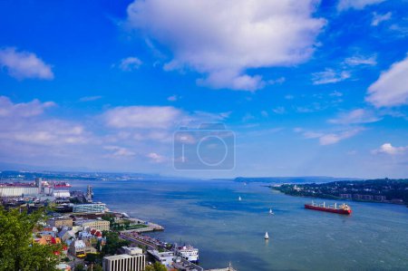 Magnificent sweeping wide angle vista of the St.Lawrence river  with boats and ships plying on a bright summer day seen from the Citadel in Quebec city, Canada