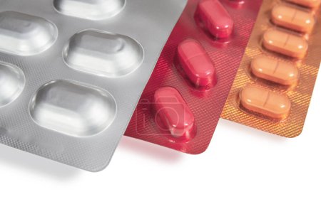 Téléchargez les photos : Capsules in different blister packs on white background. Medicines and healthcare - en image libre de droit