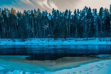 Photo for Gauja, swimming place covered with snow and ice in winter. Sunset. - Royalty Free Image