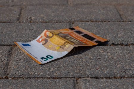 Photo for 50 euros were found on the pavement in the park. - Royalty Free Image
