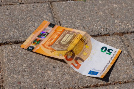 Photo for 50 euros were found on the pavement in the park. - Royalty Free Image