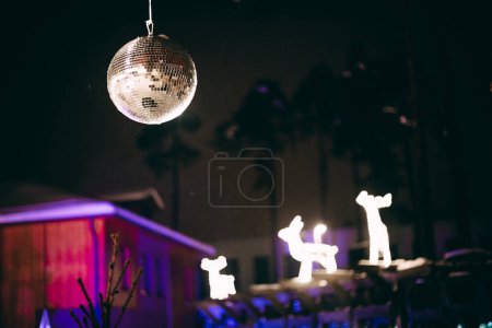 Photo for A lively family celebrates the holiday season with Christmas decorations and a Christmas deer. Atmospheric distortion, hot air distortion, heat distortion, air refraction. - Royalty Free Image