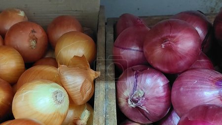 Ripe of white and red onions selling in a local grocery store, Bangkok, Thailand.