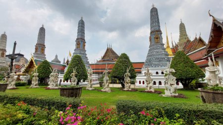 The Temple of Emerald Buddha is built from a wooden frame that adorned by rich ceramic tiles, mural paintings, gold leaf ornamentation and other important Thai mythological and religious symbolism.