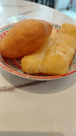 Deep-fried doughsticks, crispy and golden, perfectly complement the warmth of hot soy milk. 