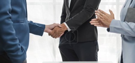 Foto de Business handshake for teamwork of business merger and acquisition,successful negotiate,hand shake,two businessman shake hand with partner - Imagen libre de derechos