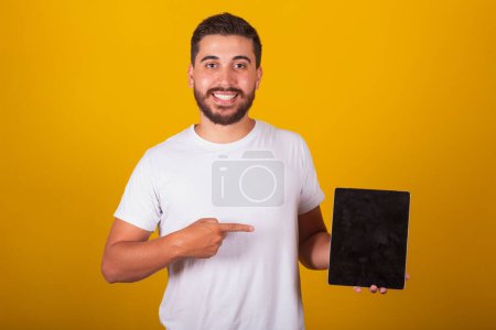 Photo for Brazilian Latin American man with table pc - Royalty Free Image