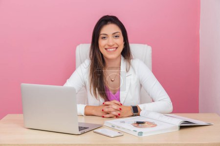 Photo for Beautician doctor, successful entrepreneur woman, smiling. aesthetic professional, businesswoman. At a table with a notebook. - Royalty Free Image