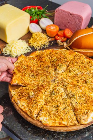 Photo for Delicious stroganoff pizza by hand, meat pizza, cheese and potato straw, baked pizza, pizza at home. - Royalty Free Image