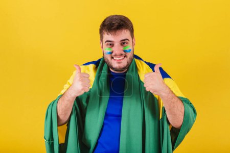 Photo for Caucasian brazilian man, brazil soccer fan, with raised index finger, approval, confirmation, like - Royalty Free Image