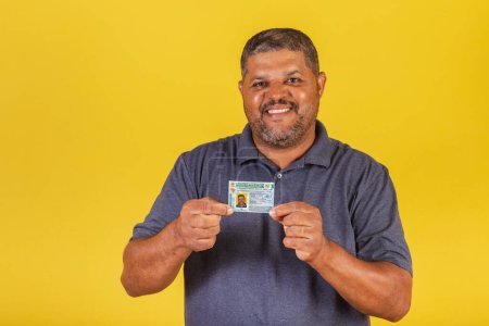 Photo for Brazilian black man, adult with driver's license, Brazilian document. - Royalty Free Image