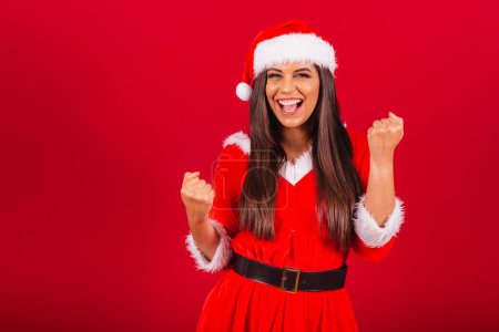 Photo for Beautiful Brazilian woman dressed in Christmas clothes, Santa Claus. celebrating. - Royalty Free Image