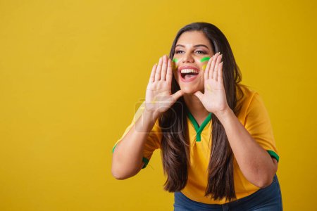 Photo for Woman supporter of Brazil, 2022 world cup, football championship, Grigan promotion, advertising advertisement. screaming goal. - Royalty Free Image