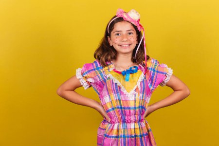 Photo for Brazilian, caucasian, child, festa junina clothes, hands on hips, confident, smiling, happy - Royalty Free Image