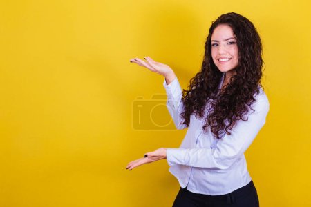 Photo for Entrepreneur woman, business woman, presenting with open hands, publicizing, showing, presenting advertisement, promotion or product. - Royalty Free Image