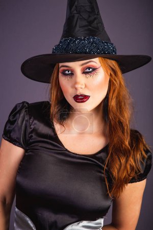 Photo for Halloween rehearsal, Caucasian woman wearing witch costume. half body portrait. - Royalty Free Image