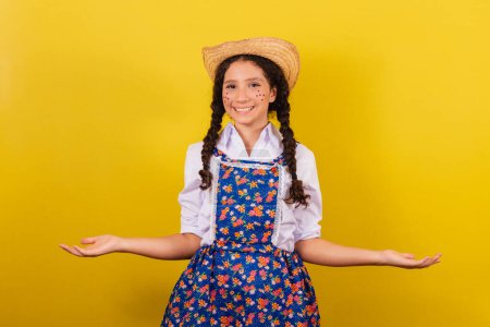 Photo for Girl wearing typical clothes for Festa Junina. with open arms, welcome, welcoming. For the Arraia party - Royalty Free Image