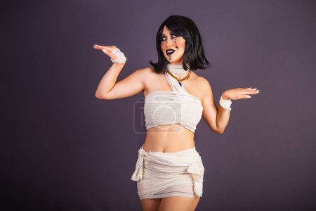 Photo for Halloween rehearsal, white woman wearing mummy costume. dancing - Royalty Free Image