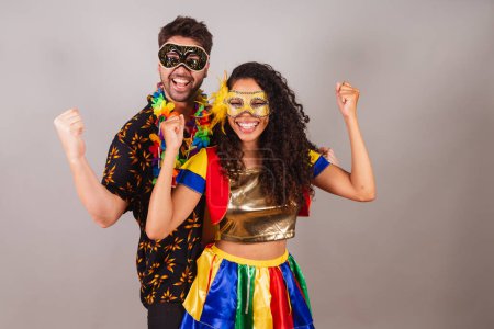 Photo for Brazilian couple, with carnival clothes. celebrating and celebrating carnival. - Royalty Free Image