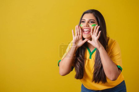 Photo for Woman supporter of Brazil, 2022 world cup, football championship, Grigan promotion, advertising advertisement. screaming goal. - Royalty Free Image