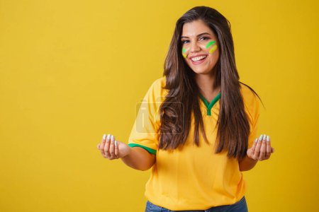 Photo for Woman supporter of Brazil, world cup 2022, football championship, calling with your hands, come here, welcome. - Royalty Free Image