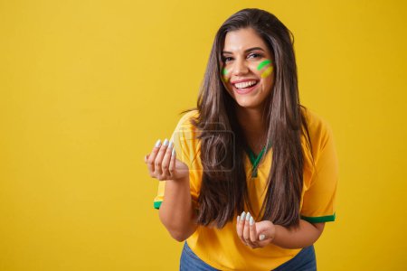 Photo for Woman supporter of Brazil, world cup 2022, football championship, calling with your hands, come here, welcome. - Royalty Free Image
