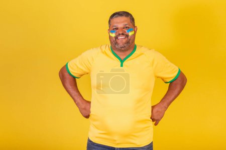Photo for Brazilian black man, soccer fan from Brazil. with hands on the waist - Royalty Free Image