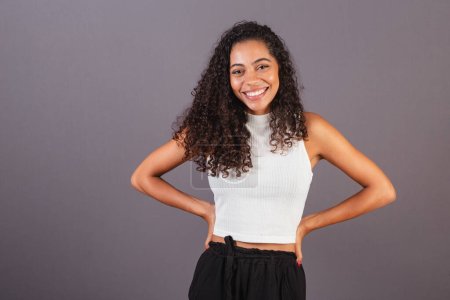 Photo for Young Brazilian black woman with hands on her hips. - Royalty Free Image