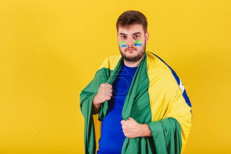 Photo for Caucasian man, soccer fan from brazil, confident, serious, ready for match. - Royalty Free Image