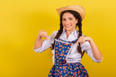 Photo for Girl wearing typical clothes for Festa Junina. symbol of here, come here. For the Arraia party - Royalty Free Image