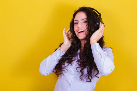 Photo for Woman listening to music on headphones. lively, happy, joyful. - Royalty Free Image