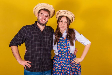 Photo for Beautiful couple wearing typical clothes for the Festa Junina. Smiling, happy. - Royalty Free Image
