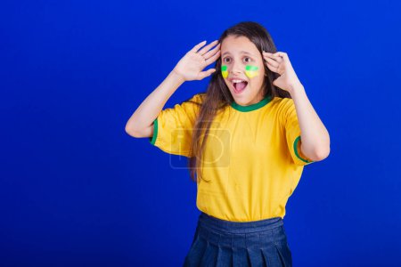 Photo for Young girl, soccer fan from Brazil, surprised. amazing. - Royalty Free Image