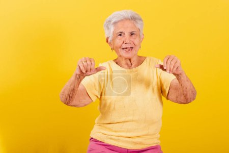 Photo for Old lady, Thumb down, disapproval, bad, denial. - Royalty Free Image