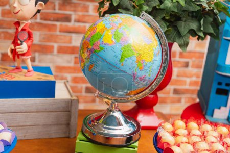 Photo for Terrestrial globe in decorated scenery, world globe, geography, basic education. - Royalty Free Image