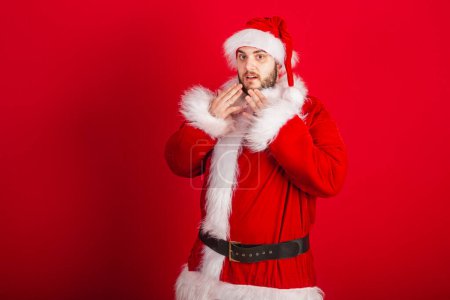 Photo for Caucasian, Brazilian man dressed in Christmas outfit, Santa Claus. surprised, wow amazing. - Royalty Free Image