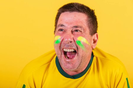 Photo for Adult man brazil soccer fan celebrating shouting goal, closeup photo - Royalty Free Image