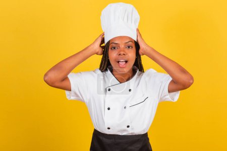 Photo for Young afro-brazilian woman, chef, hands on head, wow, amazing, surprised. - Royalty Free Image