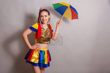 Photo for Beautiful Caucasian Brazilian woman wearing frevo carnival clothes with frevo parasol. - Royalty Free Image