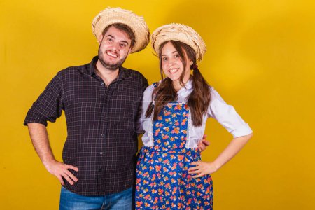Photo for Beautiful couple wearing typical clothes for the Festa Junina. Smiling, happy. - Royalty Free Image
