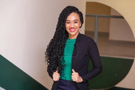 Photo for Young black woman, brazilian, entrepreneur, businesswoman, smiling in office. - Royalty Free Image