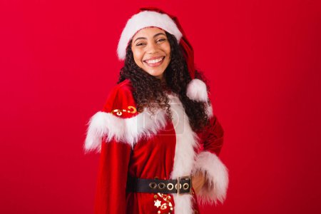 Photo for Beautiful brazilian black woman, dressed as santa claus, christmas clothes. - Royalty Free Image