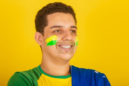 Photo for Young Brazilian man soccer fan. dressed in green, close-up photo. Brazil. - Royalty Free Image