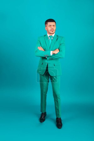 Photo for Brazilian black man, dressed in suit and green tie, Businessman. full body photo. - Royalty Free Image