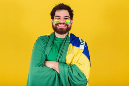 Photo for Caucasian man with beard, brazilian, soccer fan from brazil, arms crossed. - Royalty Free Image