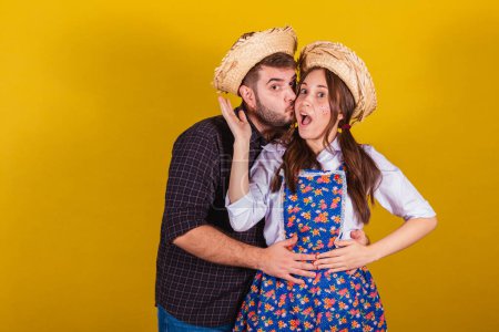 Photo for Beautiful couple wearing typical clothes for the Festa Junina. together, romantic, embraced. couple pose. - Royalty Free Image