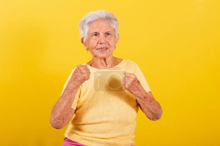 Foto de Old lady celebrating, partying and dildo, screaming yes. - Imagen libre de derechos