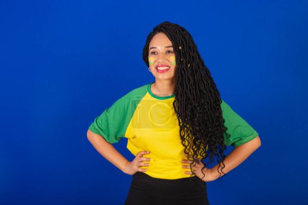 Photo for Young black Brazilian woman, soccer fan. hands on waist - Royalty Free Image