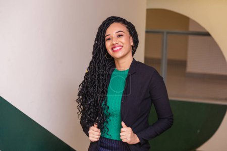 Photo for Young black woman, brazilian, entrepreneur, businesswoman, smiling in office. - Royalty Free Image