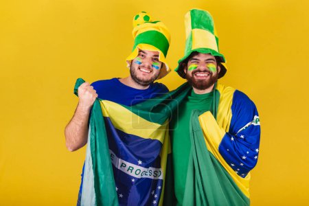 Photo for Two friends, Brazilians, soccer fans from Brazil, cheering, celebrating and vibrating in a soccer match. - Royalty Free Image